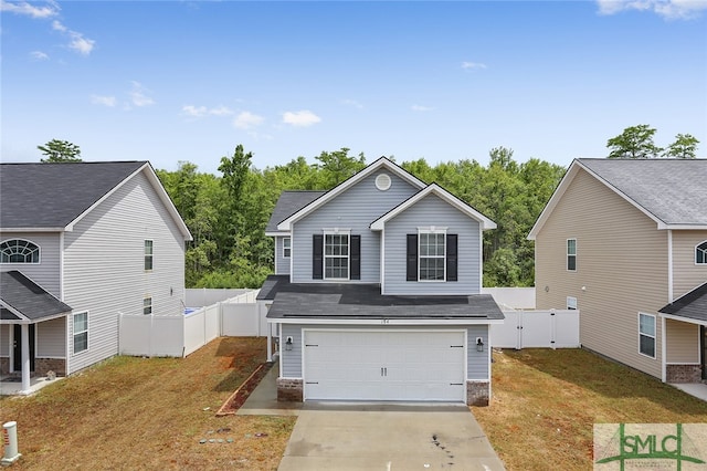 view of front of home featuring a garage and a front lawn