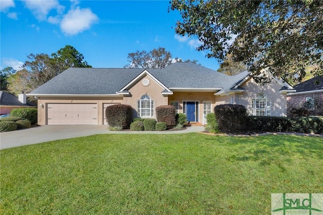 view of front of home featuring a front lawn and a garage