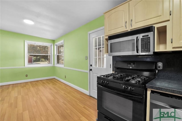 kitchen with decorative backsplash, light hardwood / wood-style floors, and stainless steel appliances