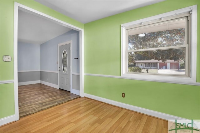 empty room with wood-type flooring