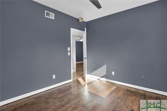 empty room featuring ceiling fan and hardwood / wood-style flooring