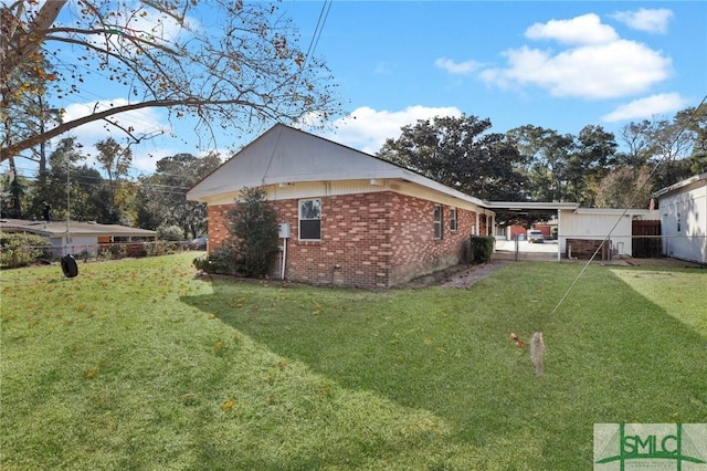 view of property exterior with a carport and a yard