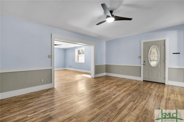 foyer with ceiling fan and hardwood / wood-style floors