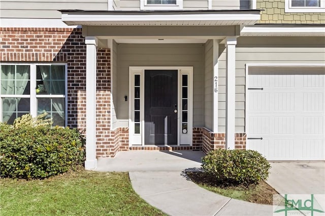 view of exterior entry featuring a garage