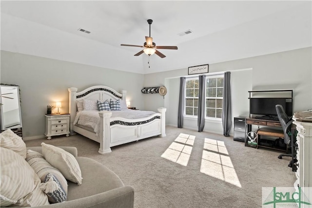 bedroom featuring ceiling fan and light carpet