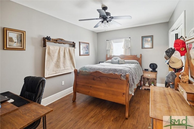 bedroom with dark hardwood / wood-style floors and ceiling fan