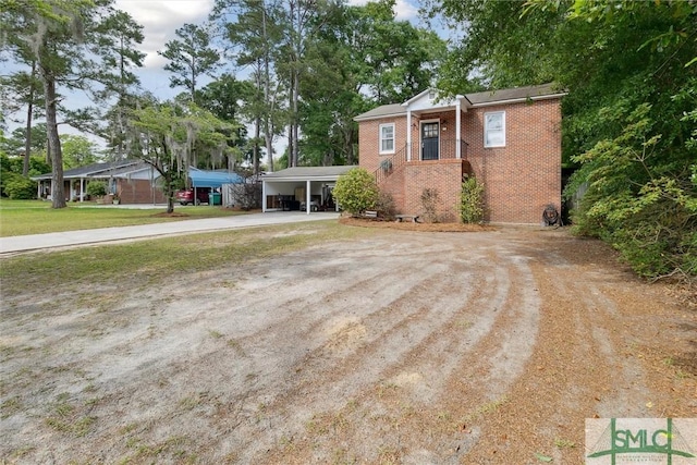 view of front of property with a carport