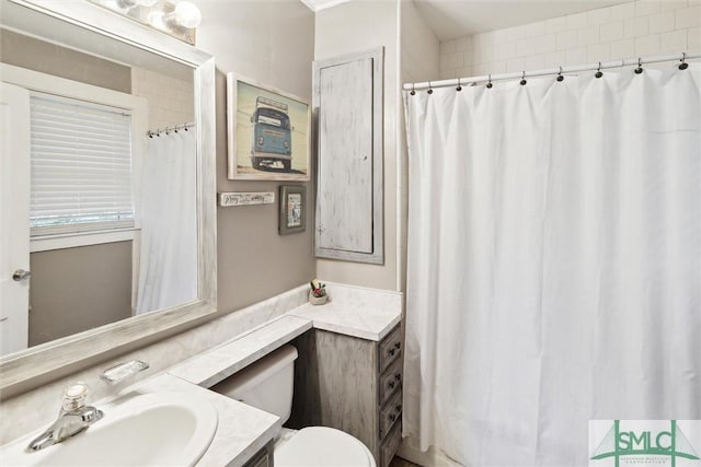 bathroom with vanity and toilet