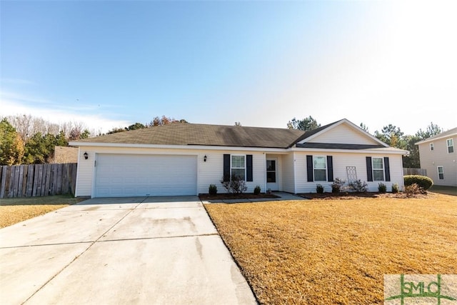 ranch-style house featuring a front yard and a garage