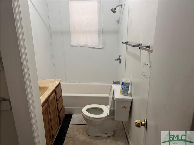 full bath featuring toilet, tile patterned floors, washtub / shower combination, and vanity