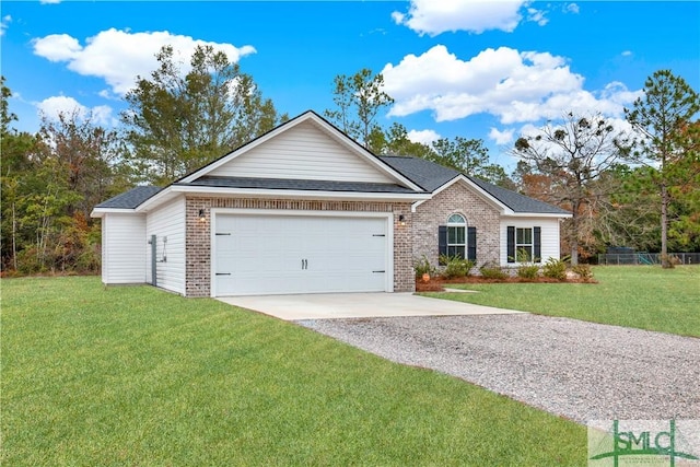 ranch-style home with a front yard and a garage