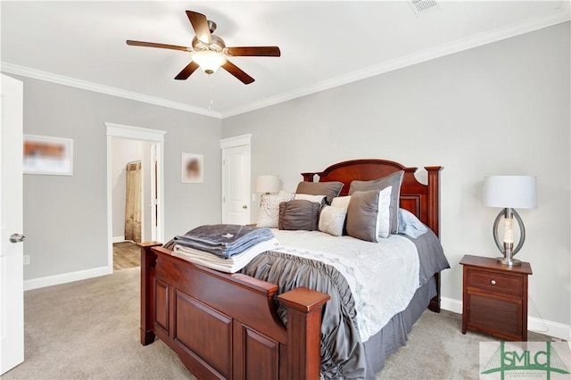 carpeted bedroom with ensuite bathroom, ceiling fan, and ornamental molding