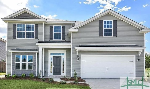 traditional-style home with concrete driveway and a garage