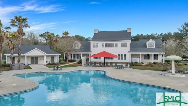 community pool with a patio area