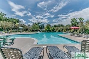 community pool featuring a patio area