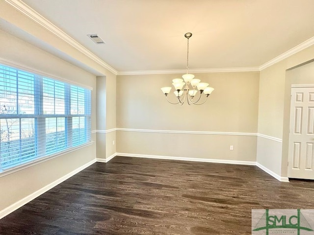 empty room featuring an inviting chandelier, wood finished floors, visible vents, and baseboards