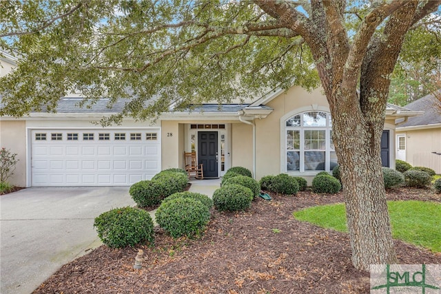 ranch-style home with a garage