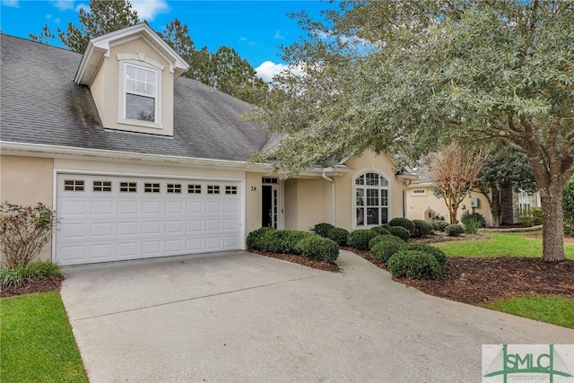 28 Turning Leaf Way, Savannah, GA 31419 - view of front of property featuring stucco siding, a garage, concrete driveway, and roof with shingles