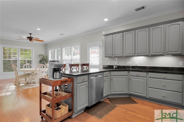 kitchen featuring dishwasher, gray cabinets, crown molding, and ceiling fan