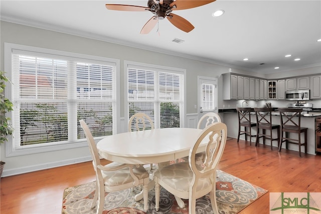 28 Turning Leaf Way, Savannah, GA 31419 - dining area with ornamental molding, ceiling fan, light wood-style floors, and recessed lighting
