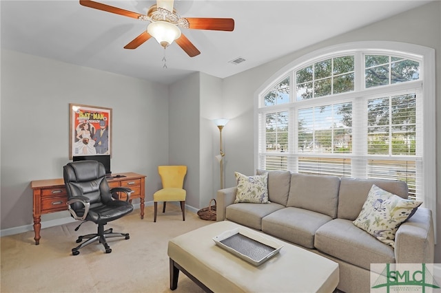 living room with carpet flooring and ceiling fan