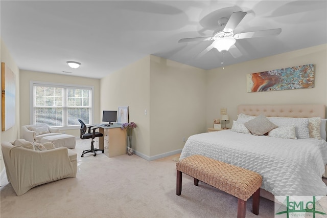 bedroom with ceiling fan and light colored carpet