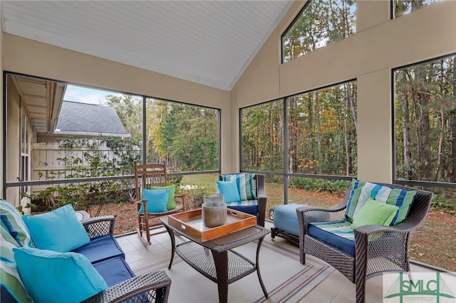 sunroom / solarium featuring lofted ceiling