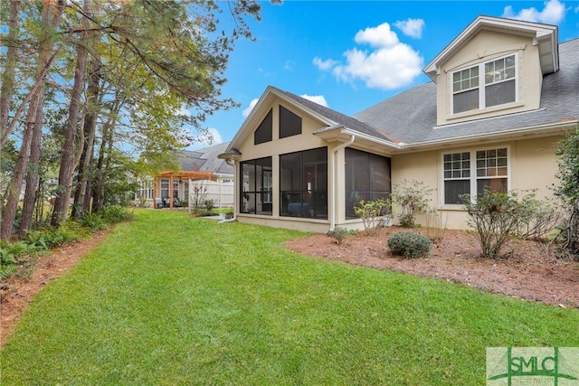 28 Turning Leaf Way, Savannah, GA 31419 - rear view of property with a sunroom, a yard, stucco siding, and roof with shingles