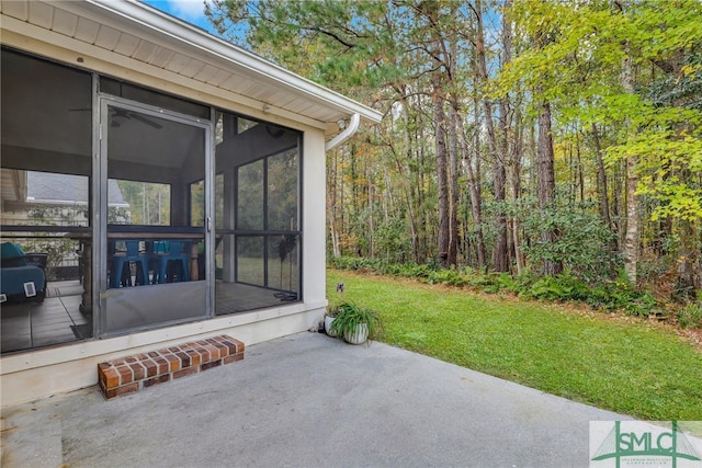 view of patio with a sunroom