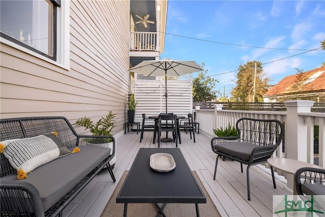 wooden deck featuring an outdoor hangout area