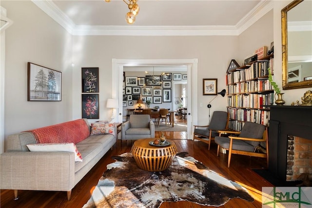 living room with dark hardwood / wood-style floors and crown molding