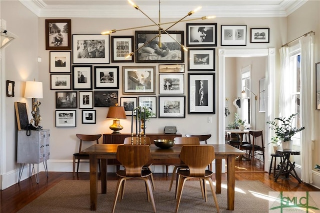 interior space with ornamental molding and hardwood / wood-style flooring