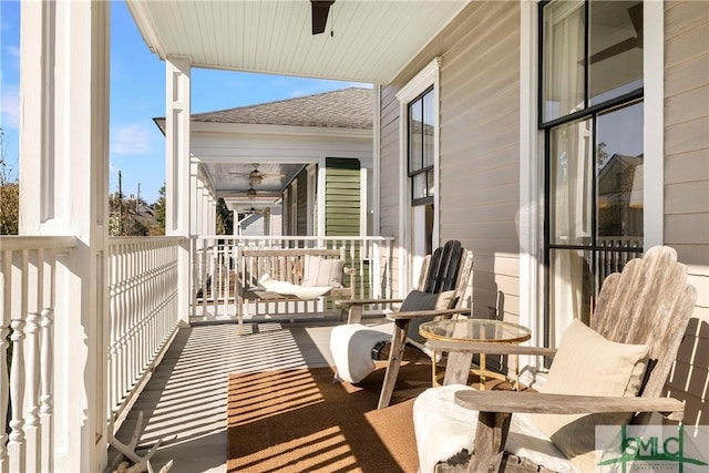 balcony with ceiling fan and covered porch