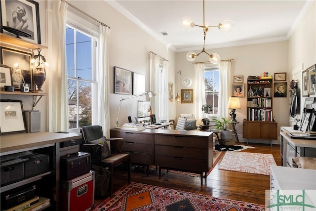 home office with a notable chandelier, crown molding, and dark hardwood / wood-style floors