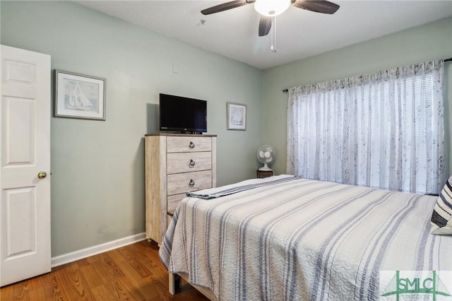 bedroom featuring ceiling fan and wood-type flooring