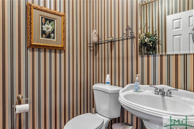 bathroom featuring sink and toilet