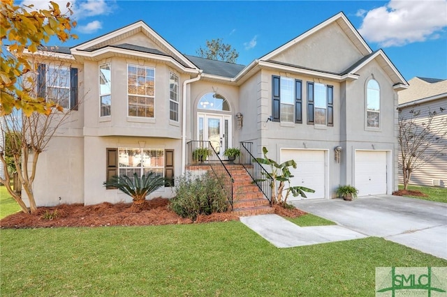 view of front of house with a garage and a front yard