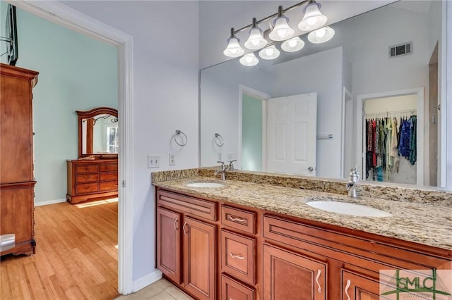 bathroom with vanity and hardwood / wood-style flooring