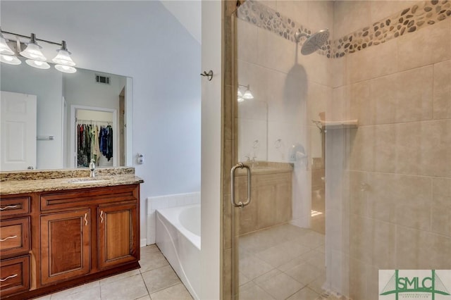 bathroom with plus walk in shower, vanity, tile patterned flooring, and vaulted ceiling