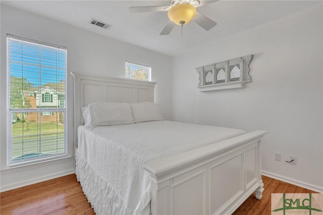 bedroom featuring light hardwood / wood-style flooring and ceiling fan