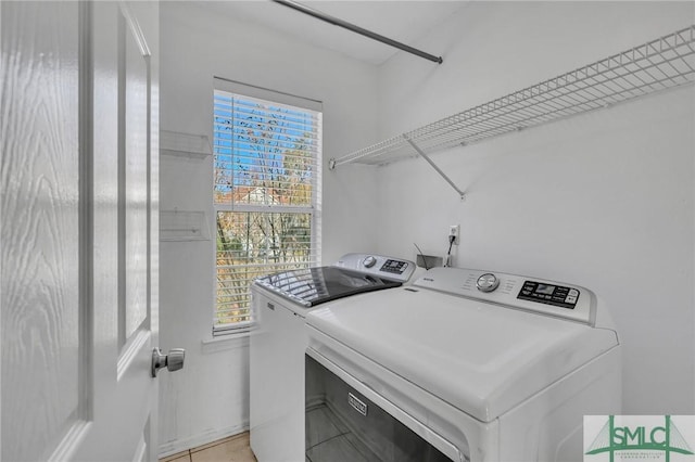 laundry room featuring washing machine and clothes dryer