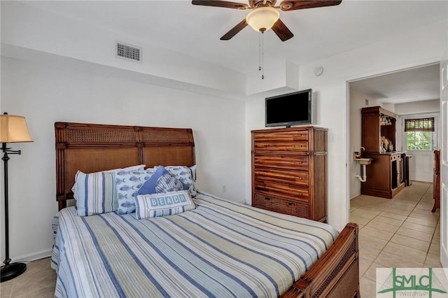 tiled bedroom with ceiling fan