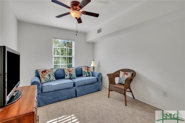 living room featuring ceiling fan and light tile patterned floors