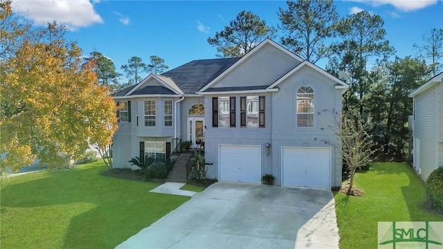 raised ranch with a front yard and a garage