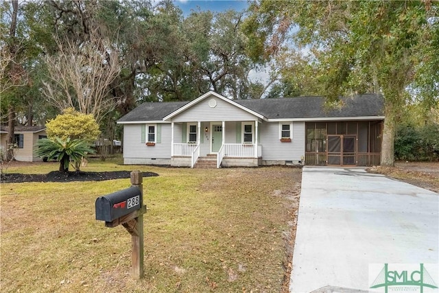 ranch-style house featuring a front yard and a porch