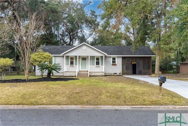 single story home with a carport, a porch, and a front yard