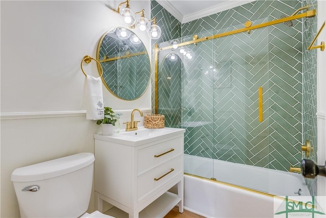 full bathroom with toilet, bath / shower combo with glass door, vanity, and crown molding