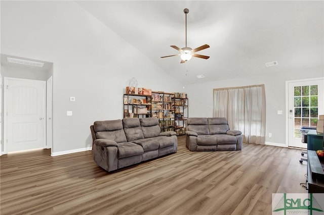 living room featuring hardwood / wood-style flooring, ceiling fan, and high vaulted ceiling