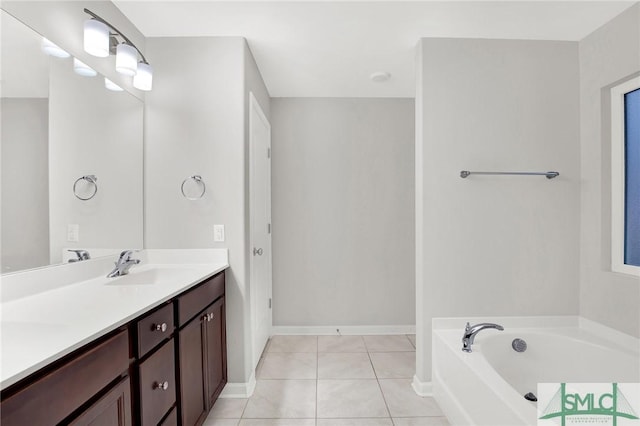 bathroom with vanity, tile patterned floors, and a bathtub