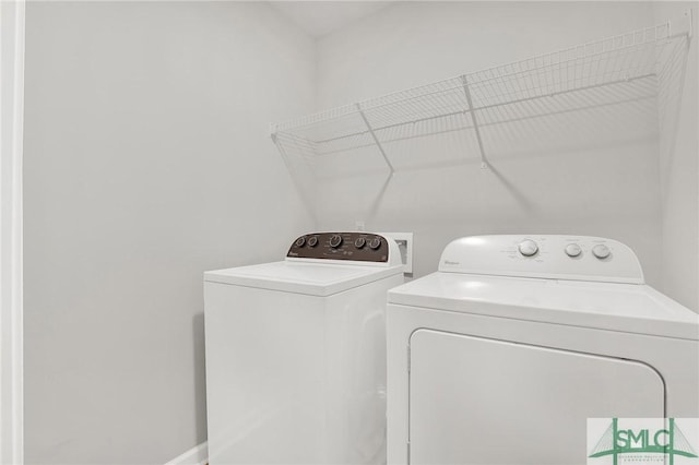 washroom with separate washer and dryer